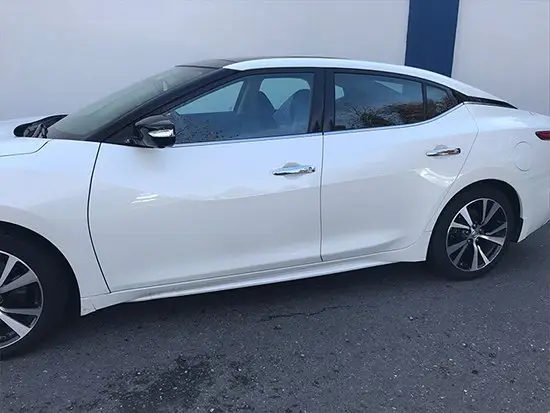 Same white coupe after repair