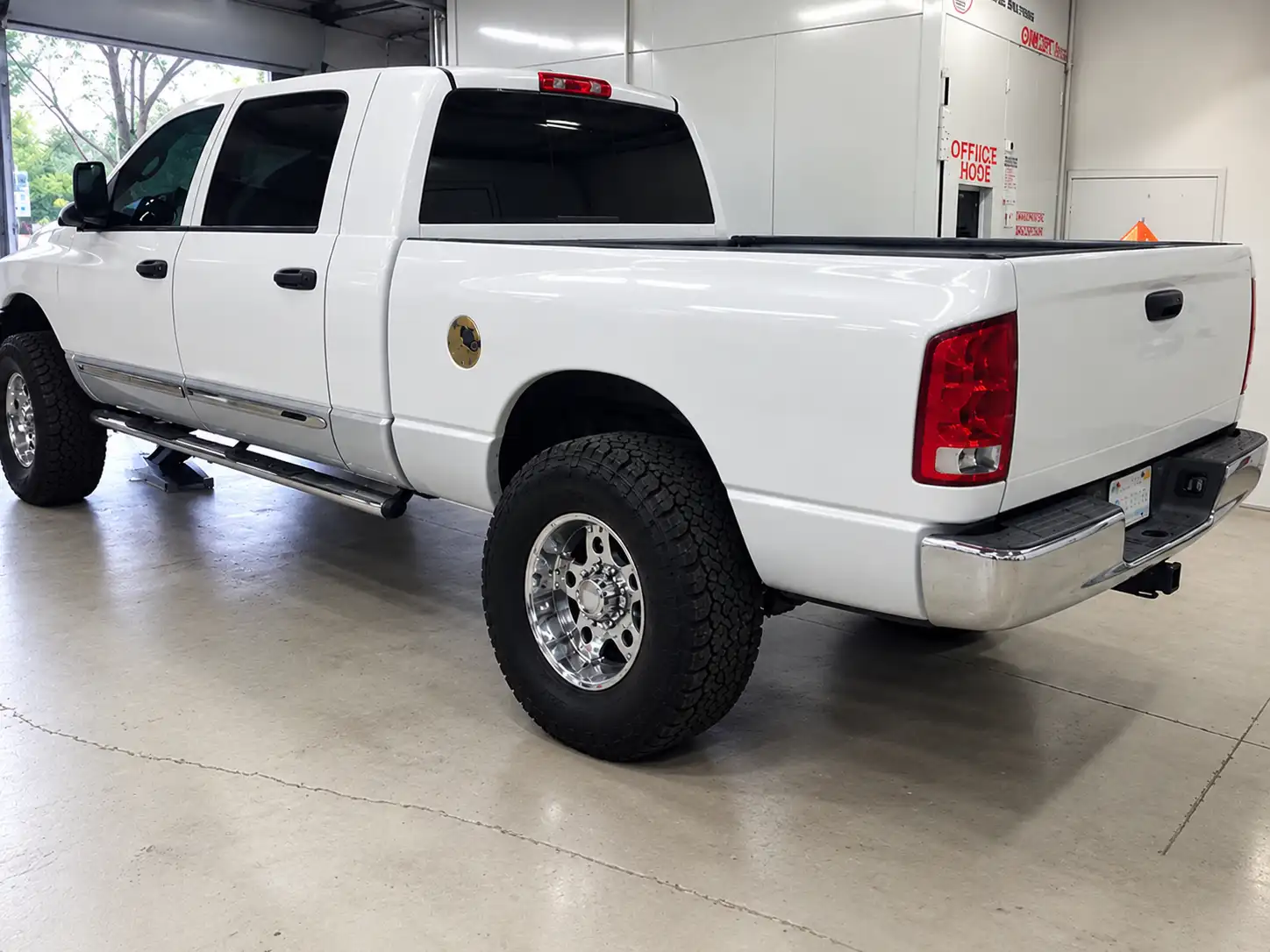 Same white pickup truck after bed side, fender and tail light repair